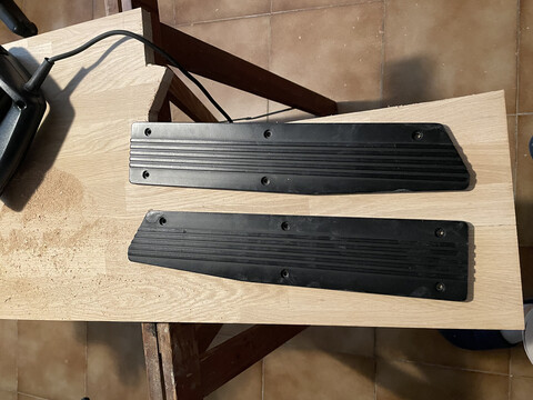 The old side panels on top of a piece of oak wood.